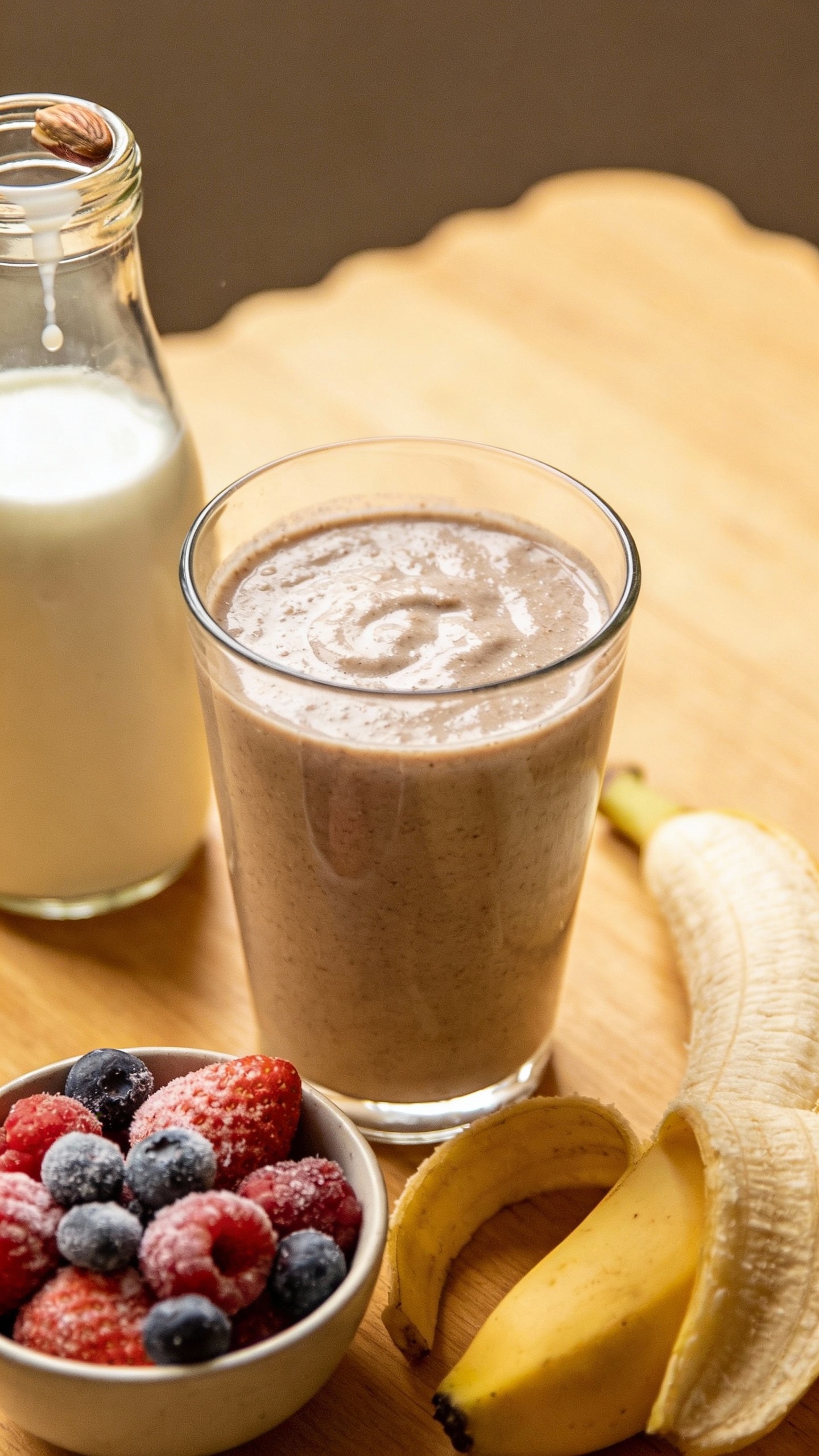 three-ingredient smoothie setup: banana, frozen berries, almond milk