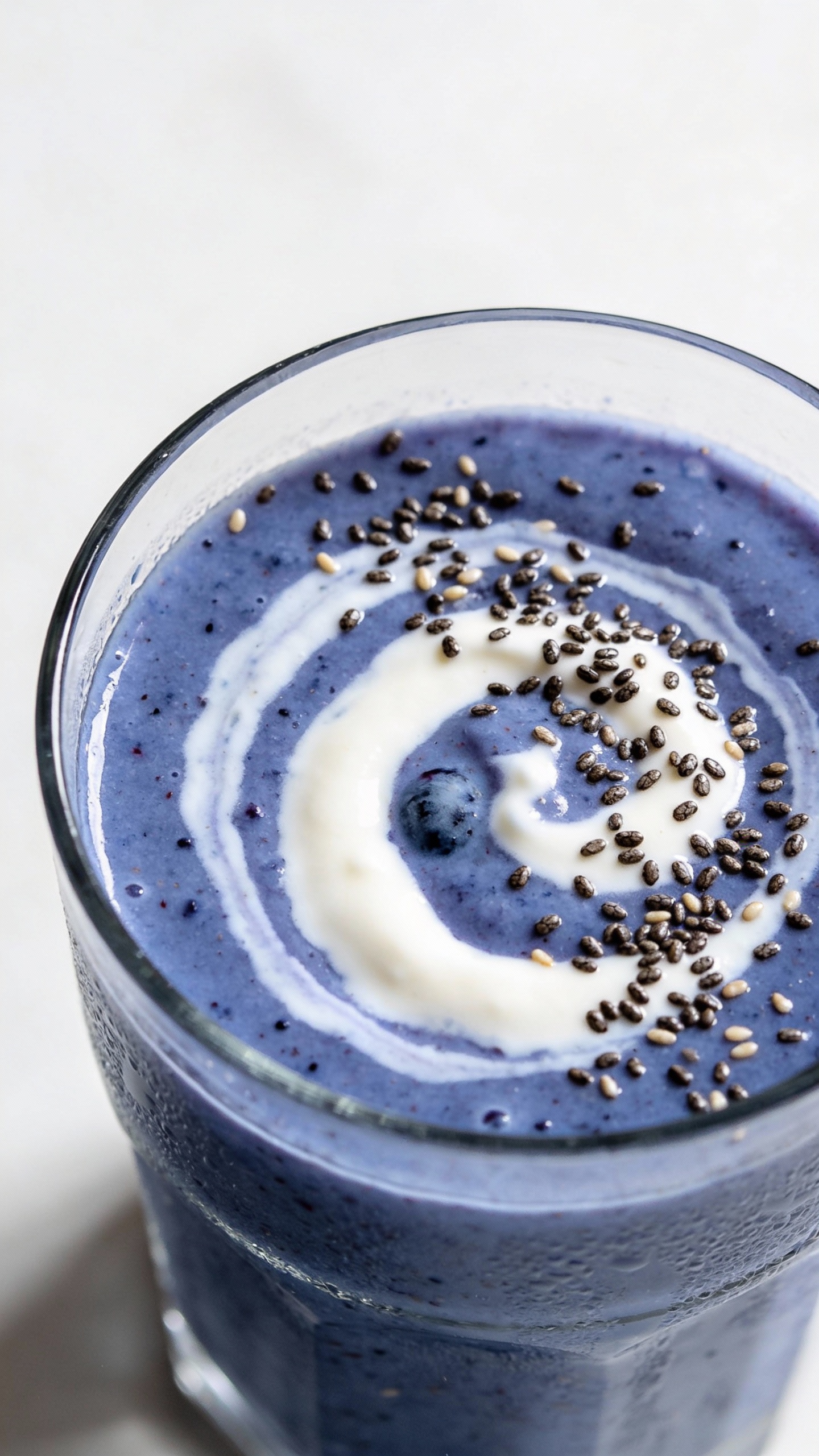 overhead blueberry oat smoothie with yogurt swirl, chia seeds